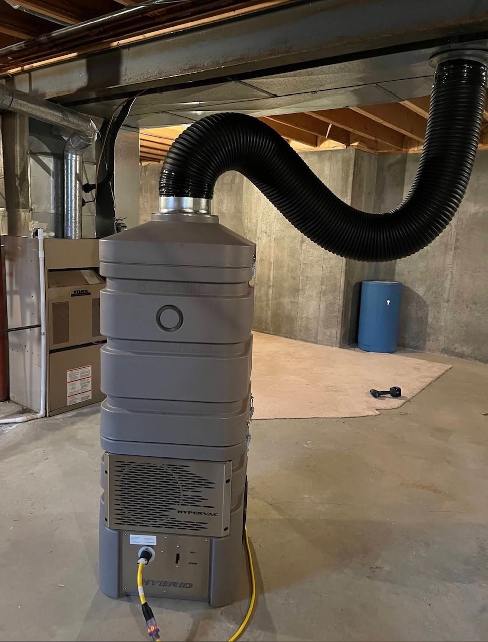 Commercial HyperVac negative air machine connected to HVAC ductwork